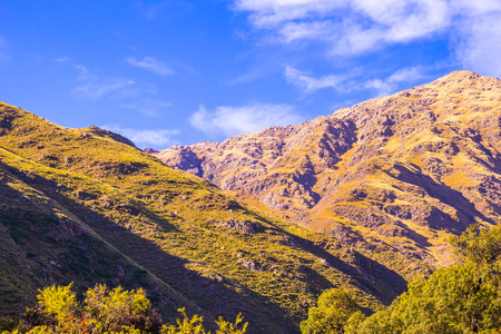 A great view of two peaks at dawn showing their amazing colors under a blue sky