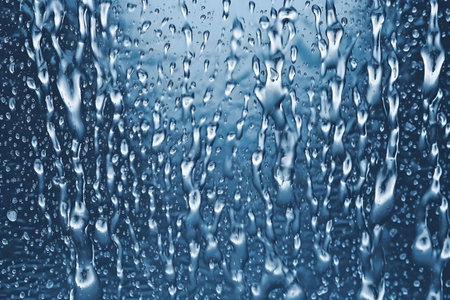 Drops of water on a blue background. Drops of rain on a blue background.Generative AIの素材