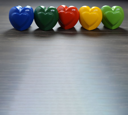Colorful hearts on a wooden background. Valentines day concept. rainbow colors. Rainbow heart. Pride day concept. Generative AIの素材