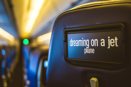 Interior of an airplane with a sign on the screen. Selective focus. Cabin.の素材