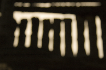 Abstract shadows in the form of vertical sticks in brown tones