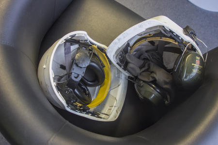 2 white helmets on a dark backgroundの写真素材