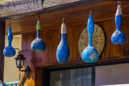dried blue painted pumpkins hanging on the balconyの写真素材