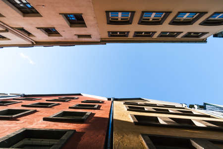 Urban street of european town. Sunny domestic springtime, simplicity outdoor background. Sky view....