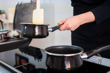 Pastry chef making a beautiful and delicious cake.の写真素材