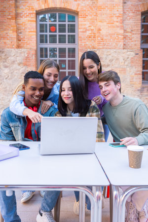 Group of students, prepare for university exams, use a laptop.Vertical