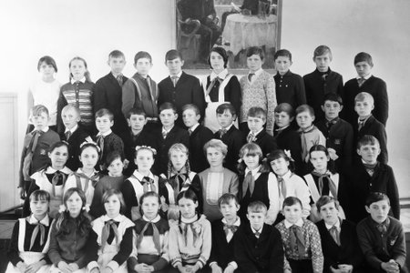 USSR, Russia, 1971st - Vintage black and white paper photo: group portrait of Soviet school students, pioneers. Old surface, soft focus. Transferred property, family archive.のeditorial素材