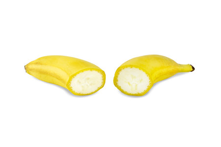 Ripe yellow banana cut in half. Isolated on white background.の写真素材