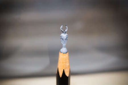 Miniature figurine of deer beetle carved at the top of pencil lead. Titiqaqa Museum - Saint Petersburg, Russia, August 2020のeditorial素材