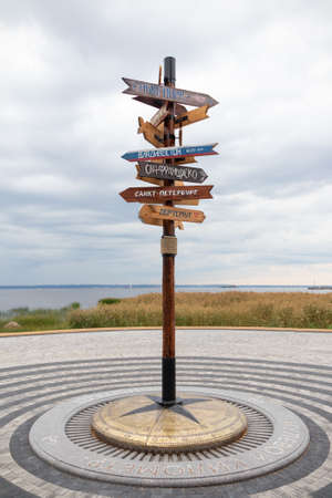 Signpost with names of cities, kilometer zero, attraction of the Island of Forts - Russia, St. Petersburg, Kronstadt, August 2021のeditorial素材
