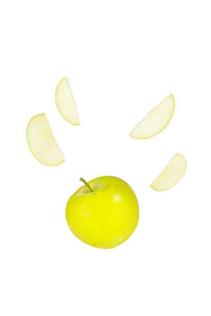 Yellow apple and apple slices isolated on white backgroundの写真素材