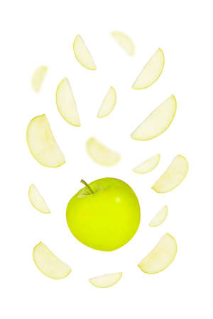 Yellow apple and apple slices levitating around isolated on white backgroundの写真素材