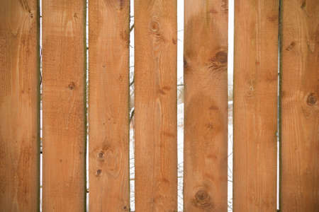 Wooden plank light-brown fence close-up, pattern, backgroundの写真素材
