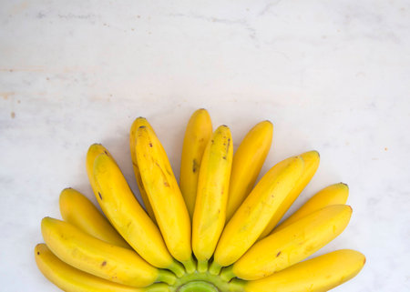 Banana Tropical Fruit Natural Product on Marble Stone Background Top View Close up Copy Spaceの写真素材