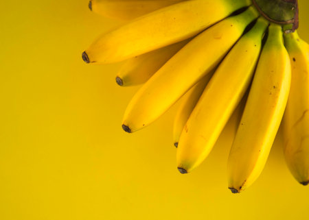 Banana Tropical Fruit Natural Product on Yellow Background Top View Close upの写真素材