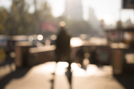 Background of abstract blurred person walking on streetの写真素材