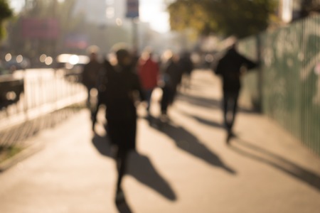 Abstract blurred people hurrying in busy streetの写真素材