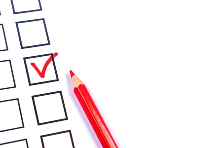 White bulletin with checkboxes and red pencil for voting, elections concept. Copy space for text.