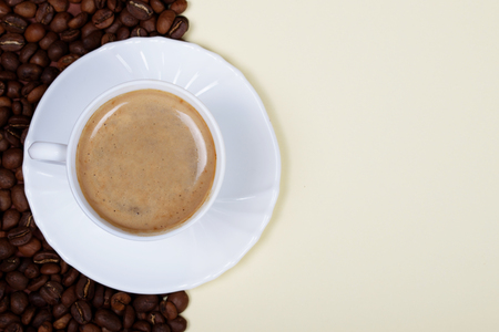 White cup of coffee on double-tone backgroundの写真素材