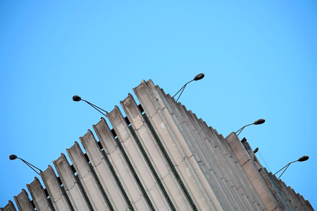 Upper edge of the building with concrete facade with lanterns.の写真素材