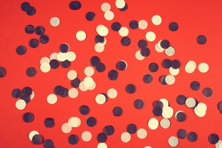 Red background with black and white confetti.の写真素材