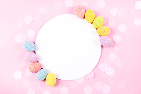 Colorful easter eggs on pink background.