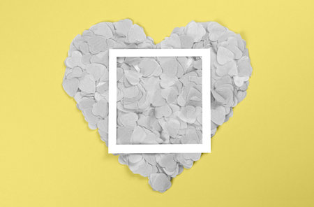 Gray heart of heart-shaped confetti with a frame.の写真素材