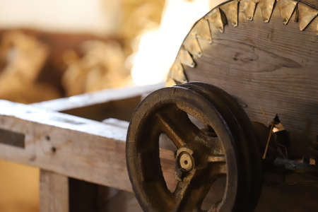 Old wooden milling machine in workshop, closeup. Logging industry