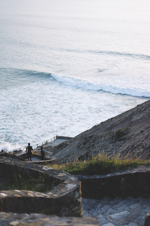 Observation deck in trip holiday in Cape Roca Portugal, top view on seascape on mountain and island in ocean, background panoramic view of the city landscape. Nature travel concept, surfer wavesの写真素材