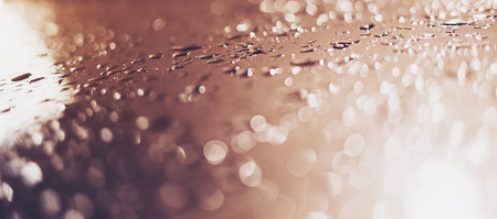 Blue glass with raindrops background texture horizontal top view isolated, rain on the window backdrop, abstract light bokeh and defocus drops, clear water on space blank back outdoors, mockup rainy nutureの写真素材
