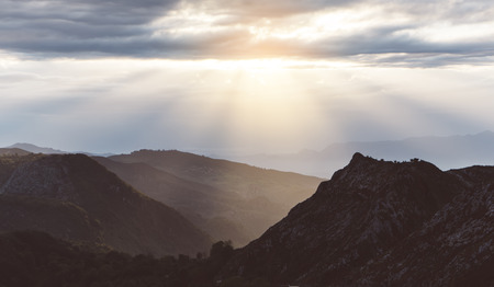morning mist in the mountain peaks on natural landscape. Green valley on background foggy dramatic sky. Panorama horizon perspective view of scenery hills Northern Spain mountain tops. Travel mockup conceptの写真素材