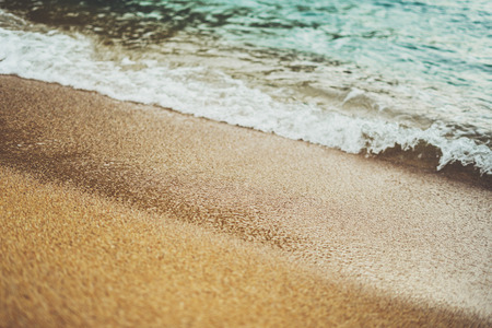 coastline beach on sunny day background of ocean and sky, gold sand close up blur, tourism relax calm concept, seascape perspective vacation, summer seashore on blue sea waves and sand at sunset, mockupの写真素材