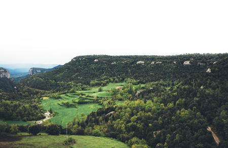 morning mist in the mountain peaks on natural landscape. Green valley on background foggy dramatic sky, mountain tops. Panorama horizon perspective view of scenery hills Northern Spain. Travel mockup conceptの写真素材