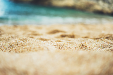 coastline beach on sunny day background of sea and sky, gold sand close up blur, tourism relax concept, seascape perspective vacation, summer walk on ocean, mock upの写真素材