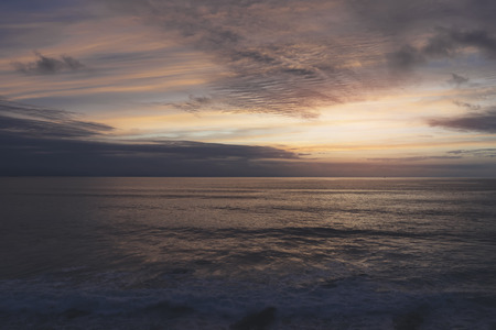 Sunlight sunset on horizon ocean on background seascape rays sunrise. Relax view waves sea on evening sand beach, sun light flare nature evening outdoor vacation concept, copy space for textの写真素材