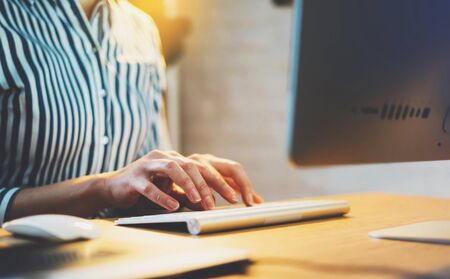freelancer working at home interior with monitor computer, finance manager typing on keyboard, online wifi internet work process in indoors workplace, social distance concept, student study online educationの写真素材