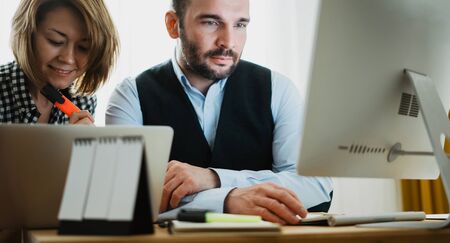 colleague designer discuss startup project, business man working at office looking in monitor computer. Managers meeting idea, alalyze marketing plans. Workplace teamwork conceptの写真素材