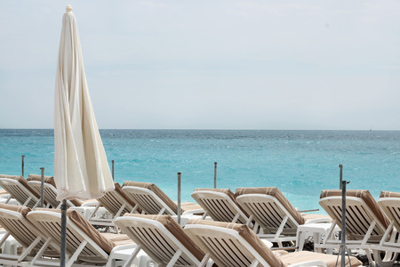 Chairs and umbrellas on Nice beach, luxury view, summer vacation outdoorの写真素材