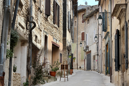 Typical street with old houses of a village in La Provence, wooden doors, windows, old street lamps, beautiful view, outdoorsの写真素材