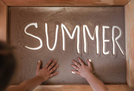 Kids drawing sand animation and dreaming about summer and lost trips during lockdown, art therapy,...