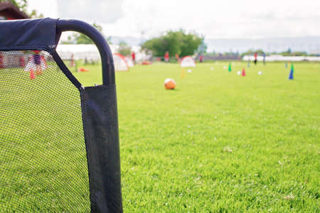 Small gate on the green grass prepared for training in kids football academy. Health and active lifestyle. Popular sport activityの写真素材