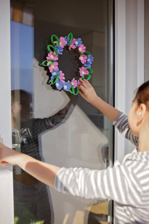 DIY project with kids, an egg carton is transformed into Easter flower wreath. Creativity and sustainability that come with a Zero Waste lifestyle. Reduce, reuse, and recycleの写真素材