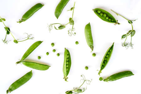 Flat lay natural light green snap peas isolated on whiteの写真素材