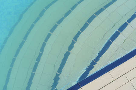 Stairs to the water pool through the water. Background. Texture. High quality photo