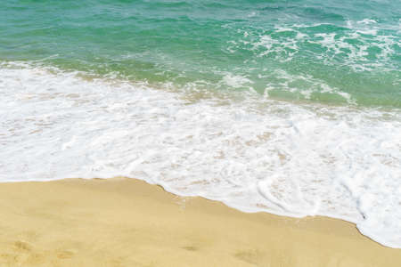 Sea waves and sandy beach. Relaxing concept photography background. High quality photoの写真素材