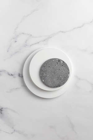 podiums. White round podiums for presentation and cosmetic. Natural beauty pedestal on white marble background. photography. top view.