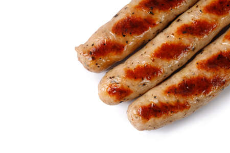Three Grilled sausages isolated on white background top view, copy space. close up.の写真素材