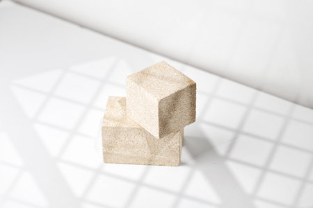 Natural Stone Podiums cubes for promotion on white background. beauty product mockup. Scene, blank for show products. Showcase, display case, pedestals with window shadow.の写真素材