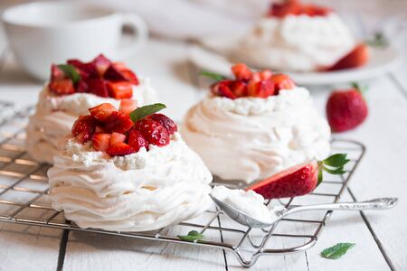 Delicious Pavlova cake made with meringue and fresh strawberriesの写真素材