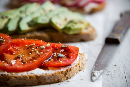 Vegetable sandwiches with radish, avocado and tomato, healthy vegetarian snack